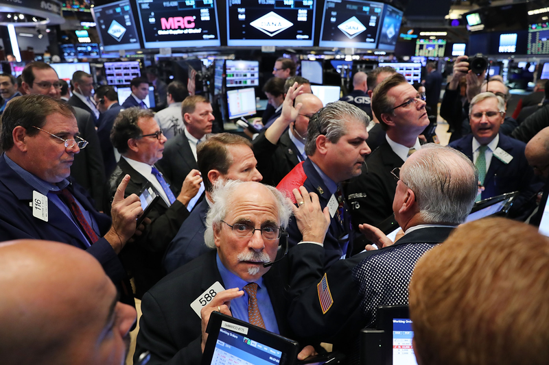 The markets react: Photo credit AP/Spencer Platt